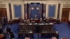 FILE - U.S. House lead impeachment manager Jamie Raskin, D-MD, hands over the House article of impeachment against former President Donald Trump, on the floor of the Senate in this this frame grab from video shot at the Capitol, Jan. 25, 2021.