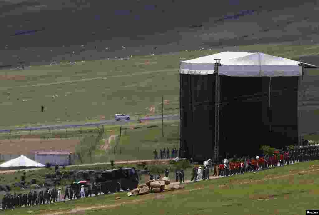 Nelson Mandela's coffin arrives at the family gravesite for burial at his ancestral village of Qunu, Dec. 15, 2013. 