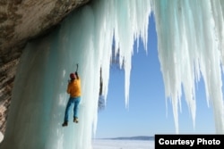 Conrad Anker climbs frozen waterfalls in Pictured Rocks National Lakeshore in Michigan. (Photo by Barbara MacGillivray, Courtesy of MacGillivray Freeman Films)