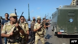 Egyptian security forces take position during a rally in support of Egypt's ousted president Mohamed Morsi and against the military on September 20, 2013, in the coastal city of Alexandria.