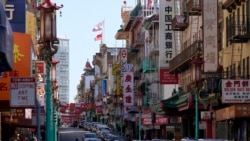 A person crosses Grant Avenue in Chinatown in San Francisco, March 25, 2021.