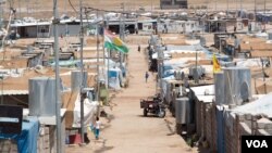Due to the overcrowding, officials say an outbreak of measles or other communicable diseases is a growing worry. (Phillip Wellman for VOA)