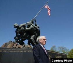 David Rubenstein, at the Iwo Jima War Memorial in Virginia, is helping to fund the restoration of the iconic statue. April 2015. (Credit: National Park Service)