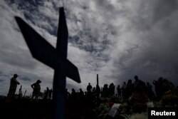 Relatives are shown during a funeral of one of the inmates who died during a prison riot in Manaus, Brazil, Jan. 4, 2017.