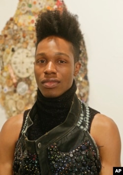 Curator Peter “Souleo” Wright poses for a portrait at the Rush Arts Gallery for The Button Show, Jan. 20, 2016, in New York.
