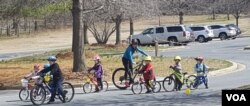 Every rider has a lightweight bike, a comfortable helmet and a pair of gloves. (F.Elmasry/VOA)