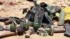 FILE - Ammunition used by suspected al-Shabab assailants killed during an attack is displayed outside Somalia's regional government headquarters in the central city of Baidoa, March 12, 2015. 