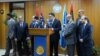 FILE - Fayez al-Saraj, flanked by members of the Presidential Council, speaks during a news conference at the Mitiga Naval Base in Tripoli, Libya, March, 30, 2016.