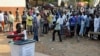 FILE - A man casts his vote at a polling station during presidential elections in Accra, Dec. 7, 2012. Ghana's Inspector General of Police John Kudalor says officers will be ”positively neutral” in the upcoming November general election.