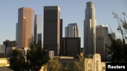 The sun sets on the downtown Los Angeles skyline, Oct. 11, 2017. Los Angeles wants to connect devices on the "Internet of Things" to become a smart city.