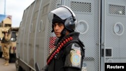 FILE - Security forces stand guard in Alexandria.