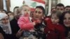 Lebanese policeman who was captured by al Qaeda-linked Nusra Front in Arsal, gets greeted by his family in Beirut, Dec. 1, 2015.
