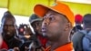 FILE - Rwandan singer Kizito Mihigo talking to reporters after his release from prison, in Kigali, Sept. 15, 2018. 