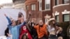 Girls dance to amplified music for Purim, Feb. 26, 2021, in the Crown Heights neighborhood of New York. The Jewish holiday of Purim commemorates the Jews' salvation from genocide in ancient Persia, as recounted in the Book of Esther. 