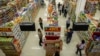 FILE - People shop in a supermarket inside a department store in Bangkok.