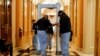 Security personnel set up a metal detector in front of an entrance to the House Chamber, on Capitol Hill in Washington, January 12, 2021.