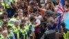 Police arrest people protesting against coronavirus mandates at Parliament in Wellington, New Zealand, Feb. 10, 2022. 