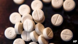 FILE - Tablets of opioid-based hydrocodone at a pharmacy in Portsmouth, Ohio, June 21, 2017. 