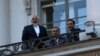 Iranian Foreign Minister Mohammad Javad Zarif (L) talks to journalist from a balcony of the Palais Coburg hotel where the Iran nuclear talks are being held in Vienna, Austria, July 9, 2015.