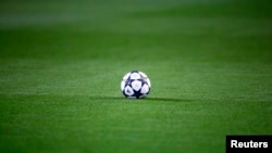FILE - A soccer ball is seen on the pitch before kick off between Borussia Dortmund and Sporting Lisbon, Feb. 11, 2016. 