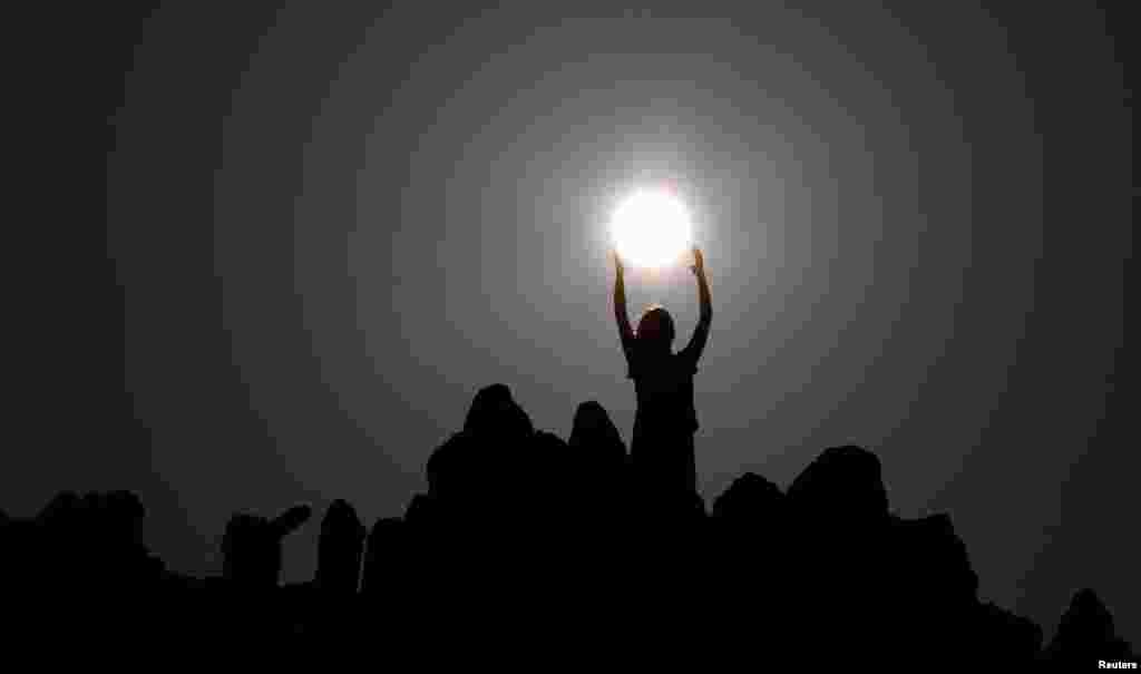 People celebrate the summer solstice at the Kokino megalithic observatory, near the city of Kumanovo, Macedonia.