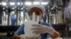 FILE - Malaysia produces roughly two-thirds of the world's disposable rubber gloves.