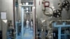 FILE - A technician is seen at the uranium conversion facility in Isfahan, 450 kilometers south of Tehran, Iran, Feb. 3, 2007. 