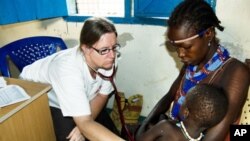 An MSF doctor examines a baby in Pibor town in South Sudan's Jonglei state in this 2012 file photo. 