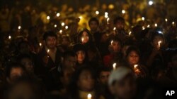 Indians hold candles as they mourn the death of a gang rape victim in New Delhi, India, Saturday, Dec. 29, 2012. 