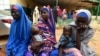FILE - Victims narrate their ordeals with bandits at Bini primary health clinic, Sokoto, Nigeria, Sept. 22, 2021. Gangs of heavily armed criminals have terrorized northwest and central states of Nigeria for years. But violence has spiraled in recent months.