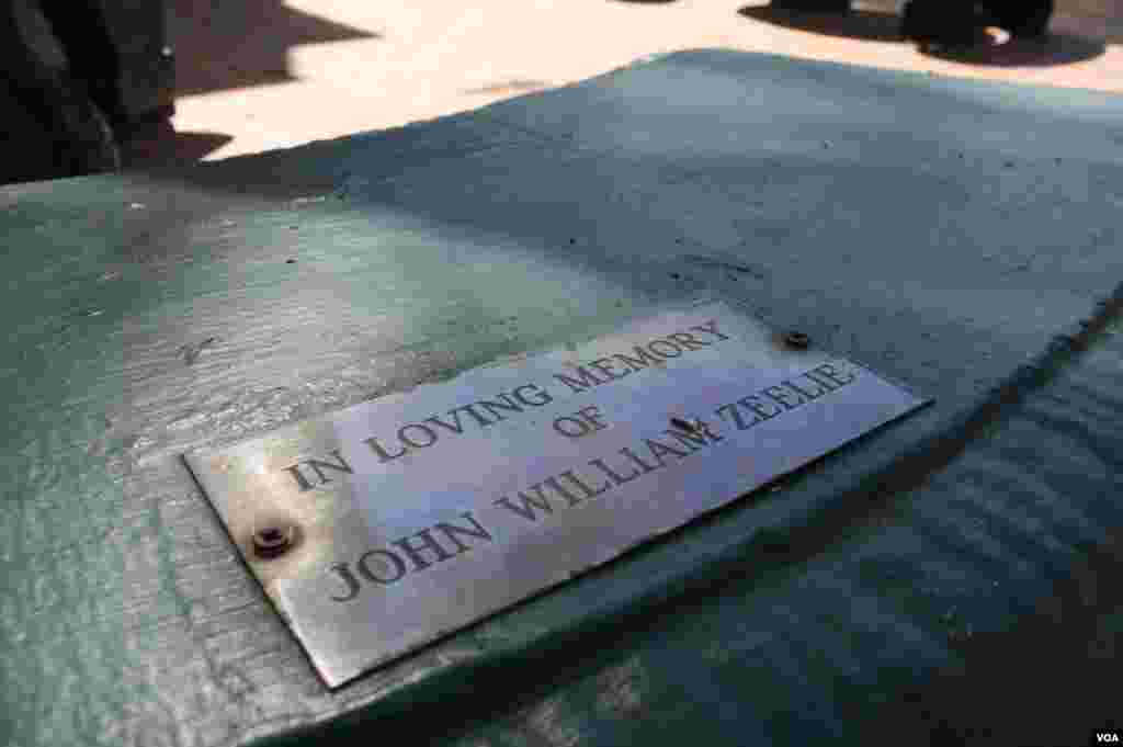 Benches in a garden of remembrance are warmed by the afternoon sun. Plaques have turned them into memorials to some of those who have died at Johannesburg's Wits Hospice. (VOA / D. Taylor)