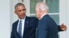 FILE - Then-President Barack Obama, accompanied by then-Vice President Joe Biden, walks back to the Oval Office after speaking in the Rose Garden of the White House, in Washington, Nov. 9, 2016.