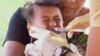 FILE - In this November 2019, image from video, a child gets vaccinated at a health clinic in Apia, Samoa.