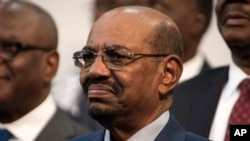 FILE - Sudanese President Omar al-Bashir smiles during a visit to Johannesburg, South Africa, June 14, 2015. South Africa said it would withdraw from the International Criminal Court following a 2015 dispute over a visit by Sudanese President Omar al-Bashir, who is wanted by the ICC for alleged war crimes, crimes against humanity and genocide in Darfur.
