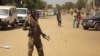 A soldier from South Sudan's army stands guard in Malakal in the Upper Nile State of South Sudan, Dec. 31, 2013.