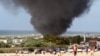 Dark smoke rises above Aden Abdule International Airport in Somalia's capital Mogadishu, August 9, 2013.