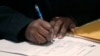 A job seeker fills out an application during a National Career Fairs job fair, April 22, 2015, in Chicago.