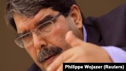 Saleh Muslim intervenant dans une conférence à Paris, France, le 13 novembre 2013. 