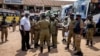 Ugandan police gather to inform people about terrorism risks and to increase security at Kisenyi bus terminal in the capital Kampala, Uganda, Oct. 26, 2021.