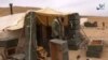 Foto yang diambil pada 11 Desember 2016 dari video yang dirilis kantor berita ISIS, Amaq news, menunjukkan pejuang ISIS di pegunungan Hayan, Palmyra selatan. 