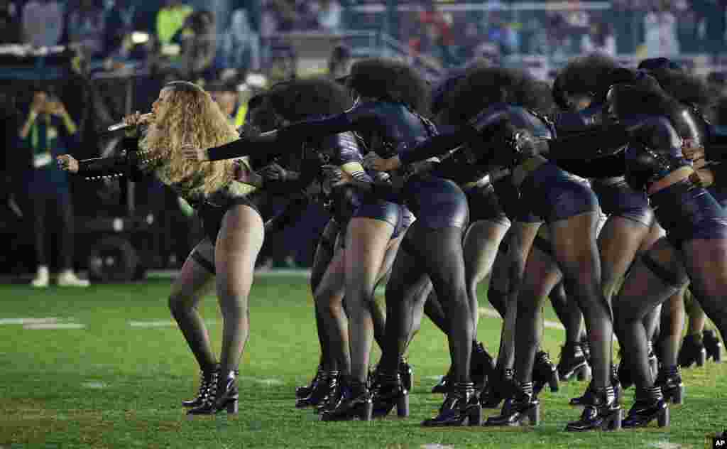 Beyonce, left, performs during halftime of the NFL Super Bowl 50 football game, Feb. 7, 2016, in Santa Clara, California.