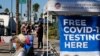 People wait in line to be tested for COVID-19 at a testing site in the North Hollywood section of Los Angeles on Saturday, Dec. 5, 2020. With coronavirus cases surging at a record pace, California Gov. Gavin Newsom announced a new stay-at-home order…