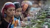 In this Saturday, Dec. 8, 2012, photo, Bangladeshi garment workers manufacture clothing in a factory on the outskirts of Dhaka, Bangladesh.