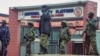 Uganda security forces stand guard outside the National Unity Platform political party offices led by Robert Kyagulanyi, popularly known as Bobi Wine, ahead of anti-government protests at the Makerere Kavule, in the suburb of Kampala, Uganda, July 22, 2024. 