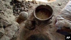 This undated photos provide by the Egyptian Ministry of Antiquities, shows a 4000-year old pottery manufacturing workshop that was recently discovered close to the Nile River in Aswan province, southern Egypt. A statement Thursday July 19, 2018, by the Antiquities Ministry said the workshop, the oldest pottery workshop in the Old Kingdom, belongs to the 4th Dynasty, from 2,613 to 2,494 B.C. 