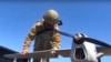 FILE - This handout photo taken from video released by Russian Defense Ministry Press Service on Aug. 8, 2022, shows a Russian serviceman preparing a reconnaissance drone. Russia shot down drones over Belgorod and the Black Sea, while Ukraine shot down a reconnaissance drone.