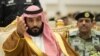 Saudi Crown Prince Mohammed bin Salman gestures during a military parade by Saudi security forces in Mecca, Saudi Arabia, Aug. 23, 2017.