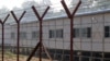FILE - Newly-built repatriation camps prepared for Rohingya refugees expected to return from Bangladesh are surrounded by barbed-wire, Jan. 24, 2018, in Taungpyo township, border town of northern Rakhine State, Myanmar.