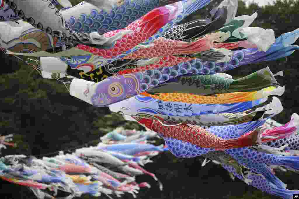 3Colorful carp streamers flutter in the air over the Sagami River in Sagamihara, west of Tokyo to mark Children's Day. It is a tradition in Japan to fly carp streamers on Children's Day.