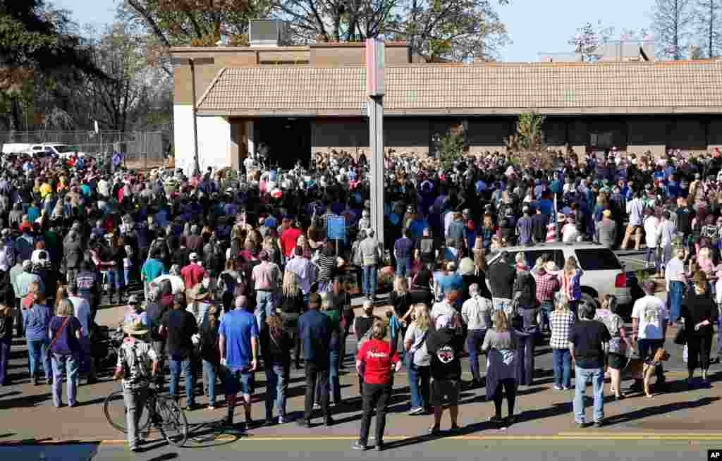 People gather for ceremonies for the one-year anniversary of the Camp Fire in Paradise, Calif., Nov. 8, 2019. There was 85 seconds of silence for the 85 people who died in last year&#39;s fire. 